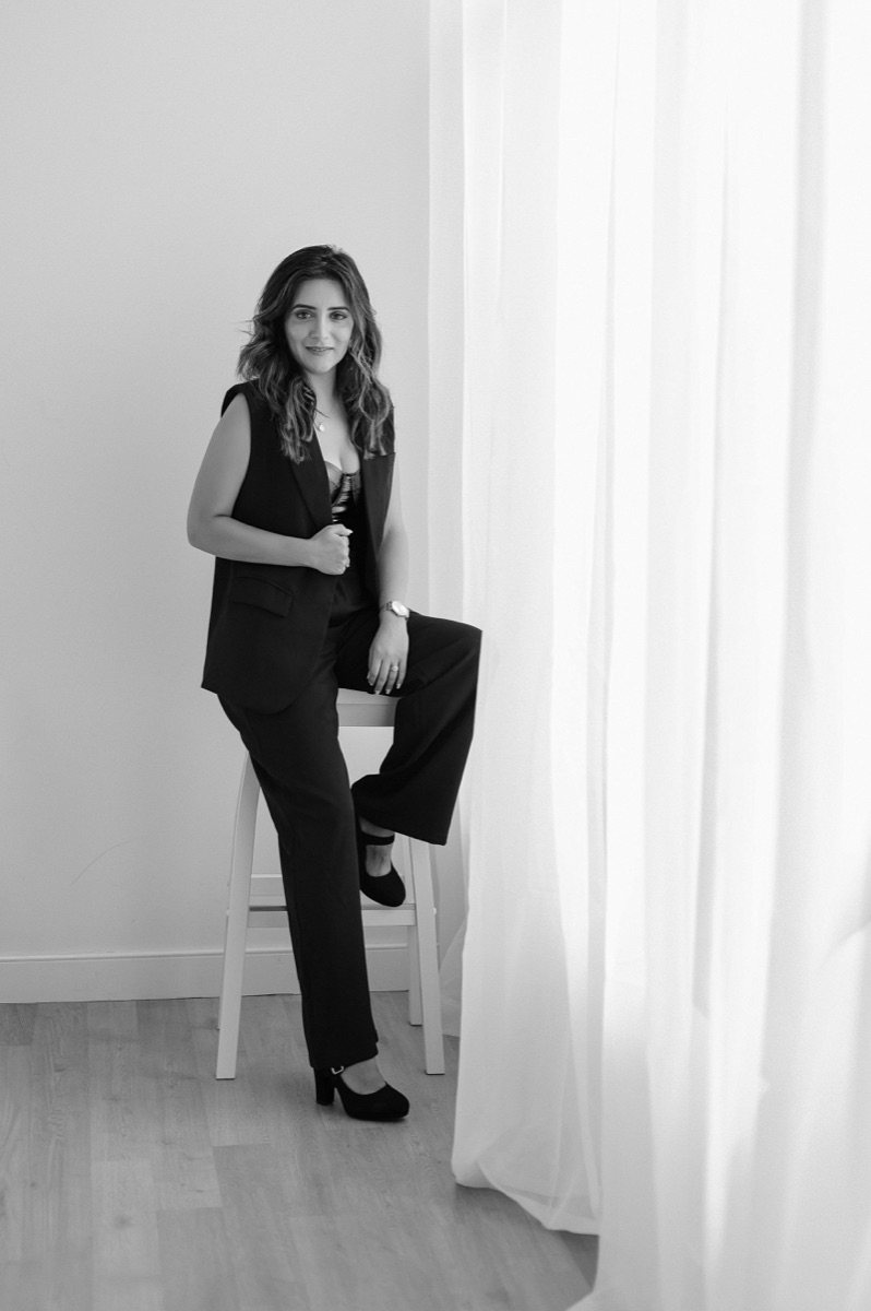 Black-and-white studio portrait of Neelam Merchant